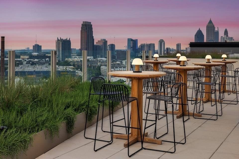 Rooftop terrace at dusk with the Atlanta skyline